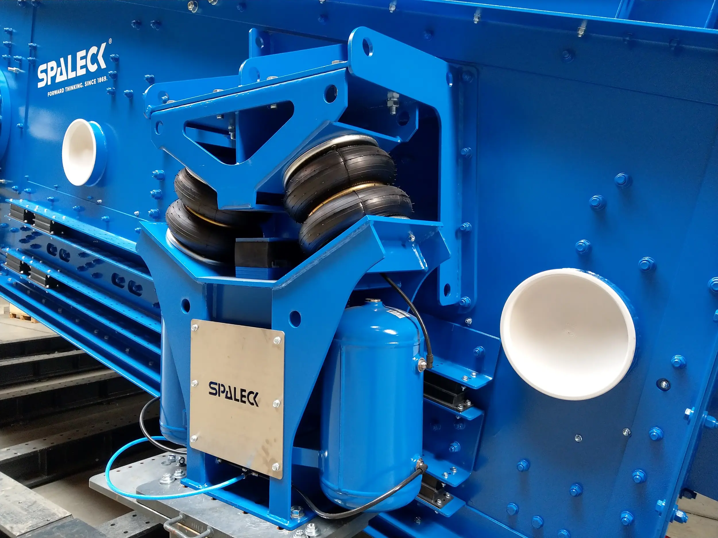 Componente azul de ingeniería mecánica de SPALECK con suspensión neumática.